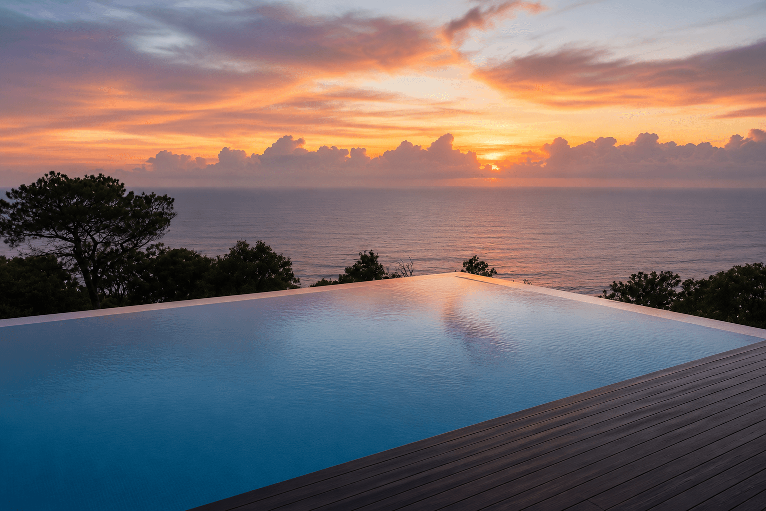 Infinity pool at sunset overlooking the ocean